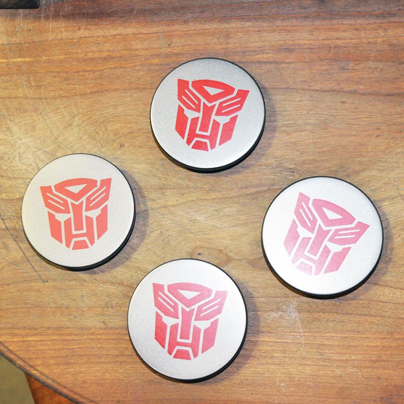 Изготовленные колпачки с логотипом Transformers
