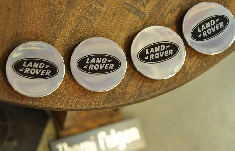 Изготовление колпачков для дисков Land Rover