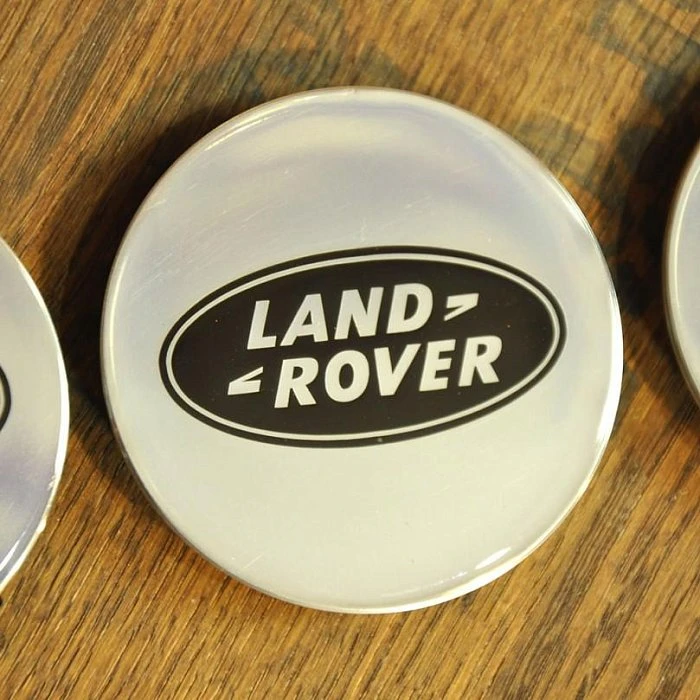 Изготовление колпачков для дисков Land Rover